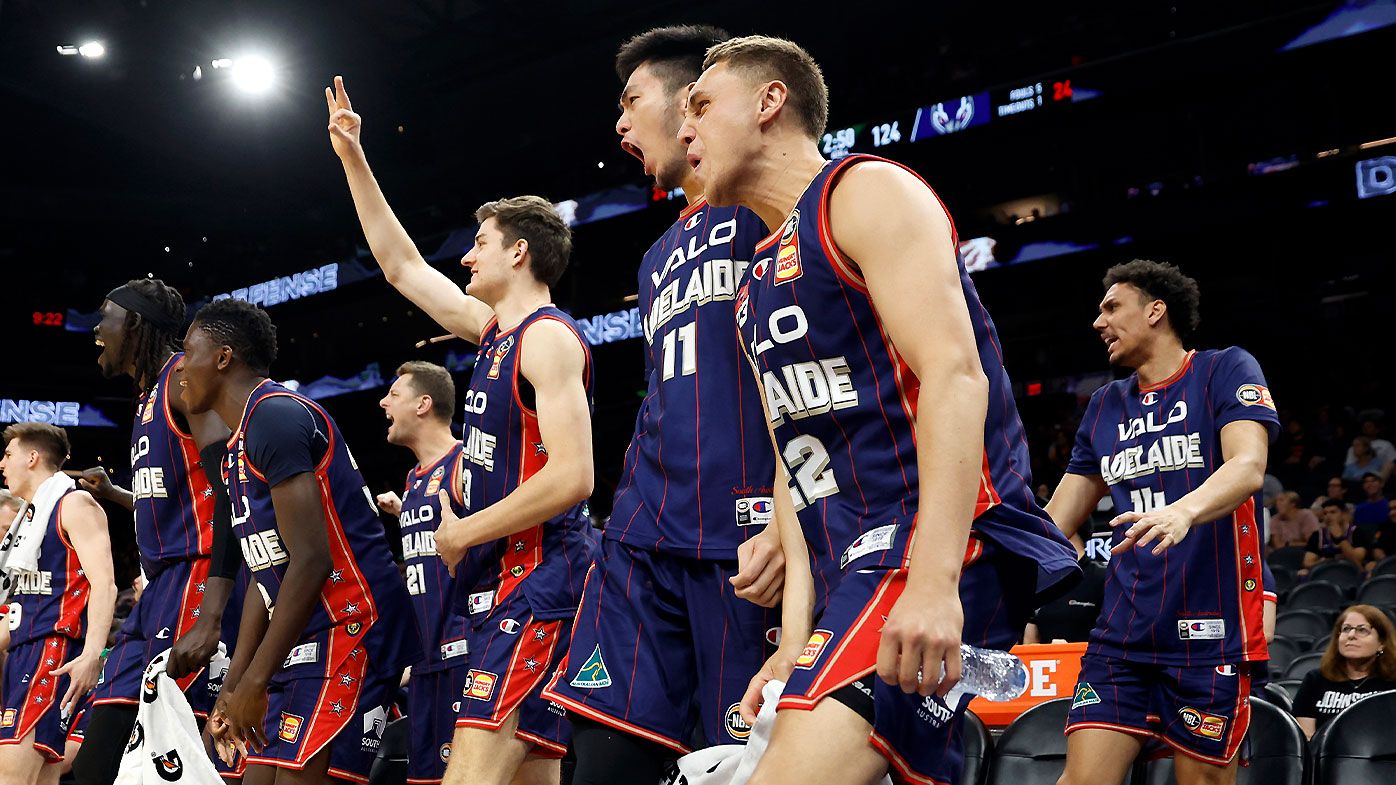 Adelaide 36ers players celebrate another basket during the win over the Phoenix Suns