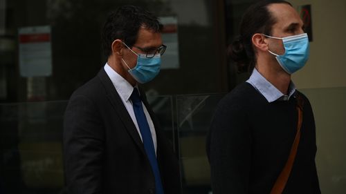 Dr William Hollaway(left) leaves the coronial inquest into Aishwarya Aswath.