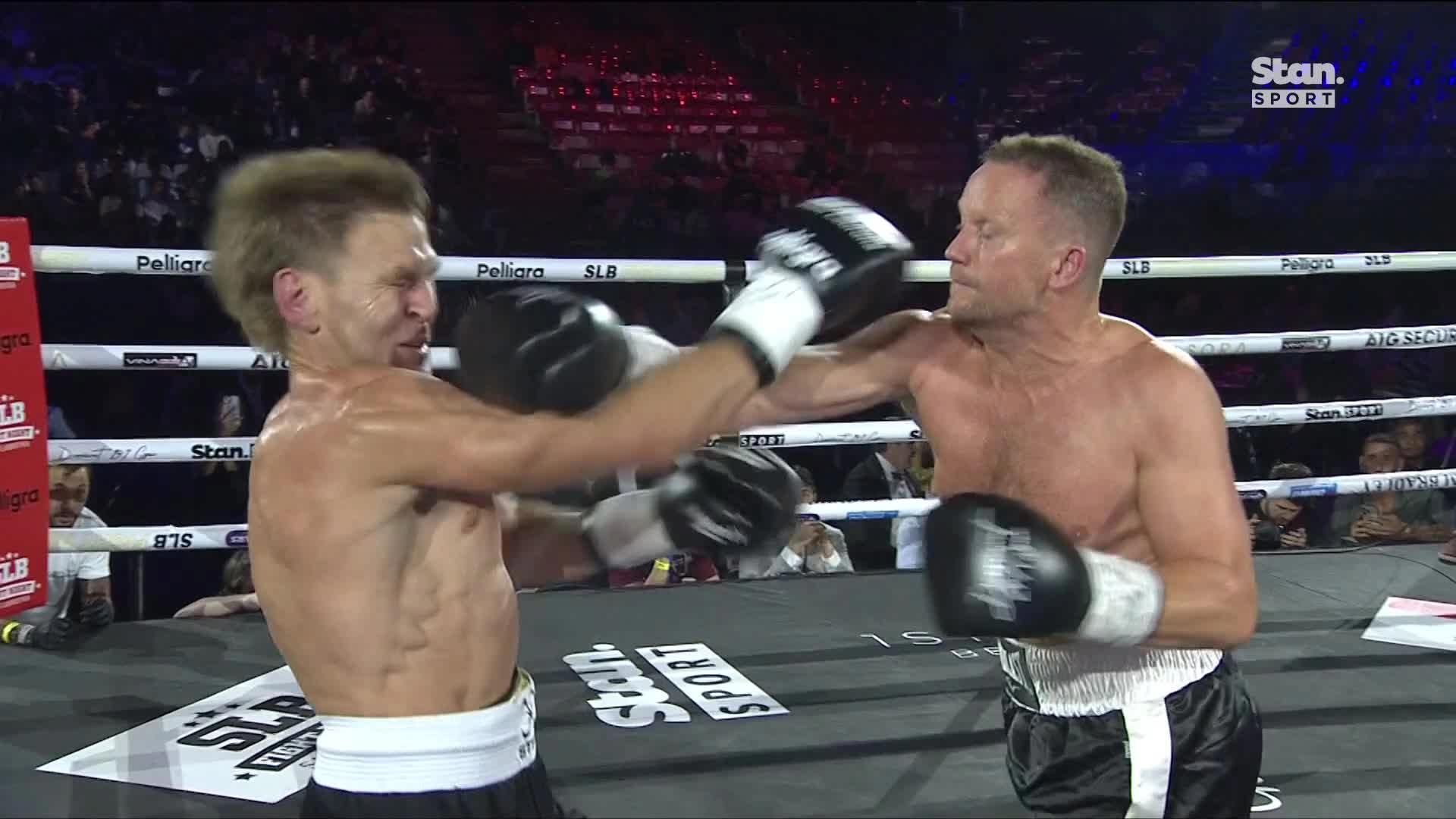 Nathan Brown lands a punch on Kane Cornes at The Gathering.