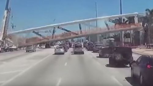 Dashcam footage captured the moment the newly-installed bridge collapsed on a six-lane road in Miami. (Youtube / OfficialJoelF)