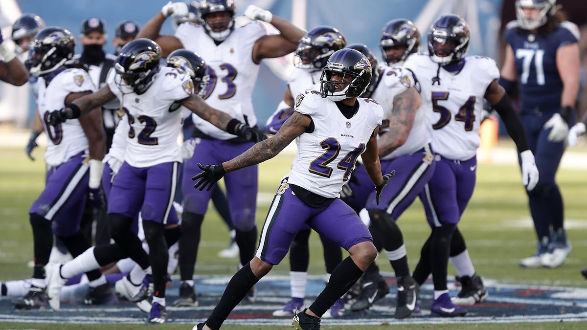 Ravens players dance on Titans' logo after fourth-quarter INT