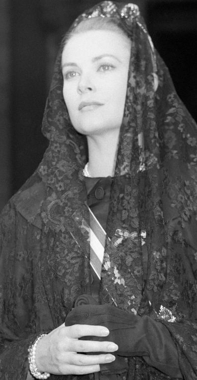 (Original Caption) 06/19/59-Vatican City: Princess Grace of Monaco, dressed in lace, stands solemnly on her visit here, June 18th. In a 35-minute audience, the Pope praised the princess and her husband, Prince Rainier, ASPA Catholic couple whose good example helps make their tiny state serene and happy. This is the royal couple's second trip to the Vatican.