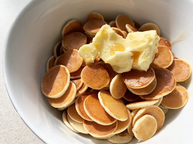 Pancake cereal with butter and maple syrup