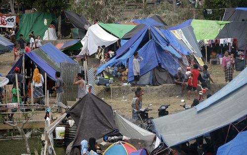 The figures come as government aid assistance has increased for the island of Lombok, where people have resorted to living in tents. Picture: AAP.