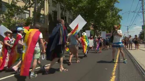 The march came as Premier Daniel Andrews announced funding for the next three years of the Midsumma Festival. (9NEWS)