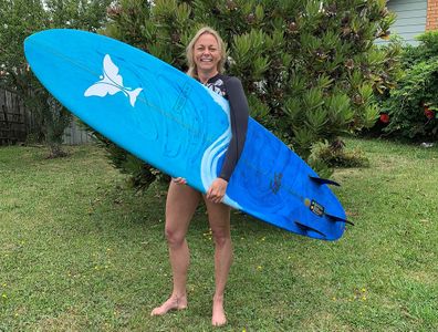 Lorraine holding surf board