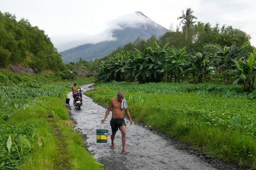 A tourist draw for its picturesque conical shape, 2462-metre Mayon last erupted violently in 2018, displacing tens of thousands of villagers.