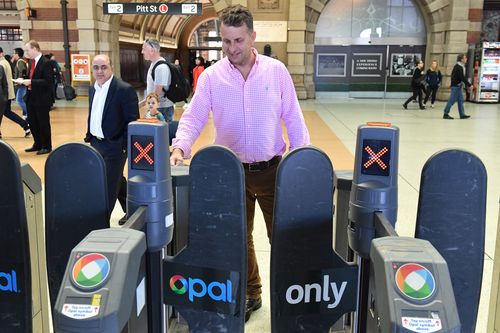 Andrew Constance goes through an Opal Card turnstile after a press conference at Central Station last year. Picture: AAP