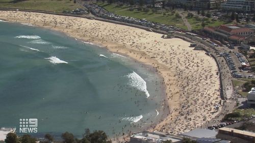 Thousands flocked to Sydney beaches despite surge in COVID-19 numbers in some city suburbs.