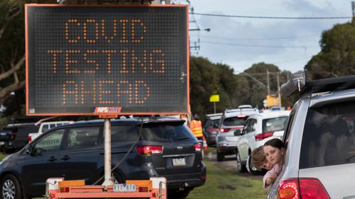 People wait for virus testing in Melbourne