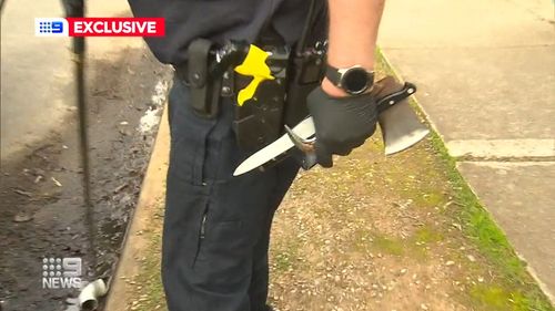 Police claimed they found a replica gun, sword and axe in the BMW after a dangerous pursuit through Adelaide's north on Monday.