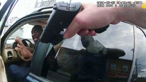 George Floyd is confronted by police shortly before his death, as seen in bodycam footage.