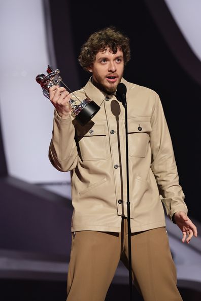 Jack Harlow accepts the Song of the Summer award for First Class from Dove Cameron onstage at the 2022 MTV VMAs at Prudential Center on August 28, 2022 in Newark, New Jersey. 