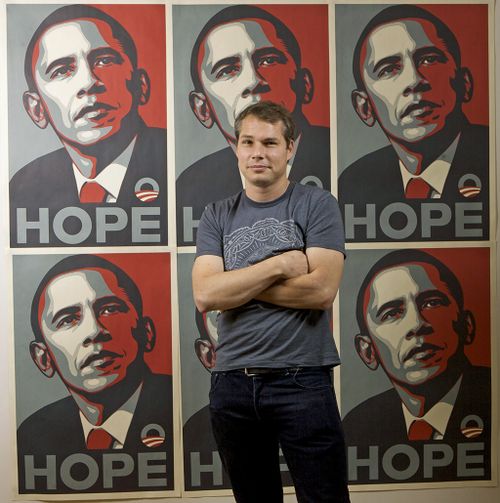 Los Angeles street artist Shepard Fairey poses for a picture with his Barack Obama Hope artwork. (AAP)