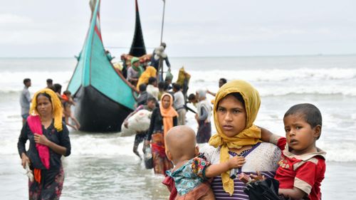 Rohingya Muslim refugees arrive by boat near Cox's Bazar, southeastern Bangladesh. (AAP)