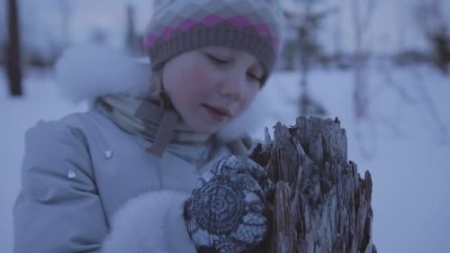 A Norilsk child looks at a tree damaged by acid rain