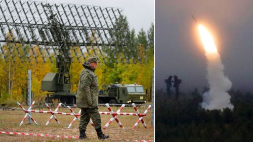 Russian soldiers, right, fire an air defence missile monitored by a mobile radar unit.