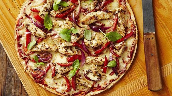 Mediterranean chicken pizza with basil