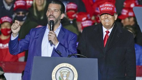 President Donald Trump watches as Donald Trump Jr. speaks at a campaign event at the Kenosha Regional Airport in Kenosha, Wisconsin (Photo: November 2, 2020)