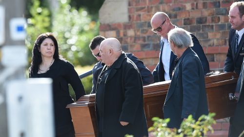 Roberta Williams carries the casket as a pall bearer at the funeral for George Williams at Saint Therese's Parish in Melbourne on May 23, 2016. (AAP)