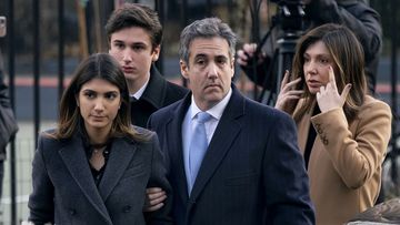 Donald Trump's lawyer Michael Cohen arrives with his family at court for sentencing.