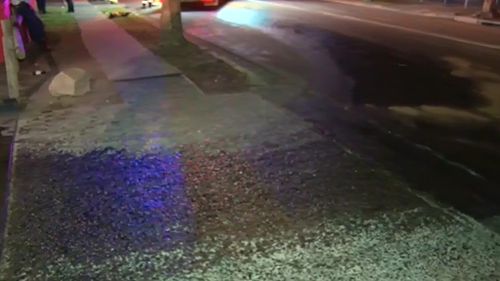 A motorcyclist slipped and fell on oil leaking from a takeaway shop. (9NEWS)