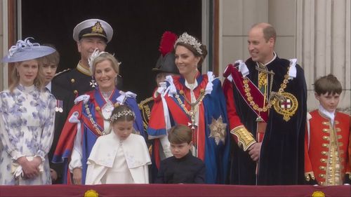 The Prince and Princess of Wales, Princess Charlotte, Prince Louis, Prince Edward, Sophie, Duchess of Edinburgh, Lady Louise Windsor and James Viscount Severn on the balcony of Buckingham Palace following the coronation of King Charles III.