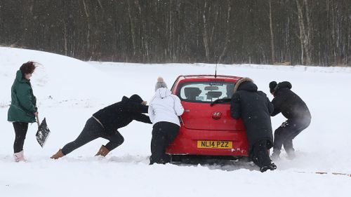 The freak weather event has hit so strongly, many across the UK and Europe have been stranded in their cars (AAP).