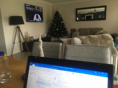 Sydney resident Keith Ford is keeping an eye on the cricket while working from home.