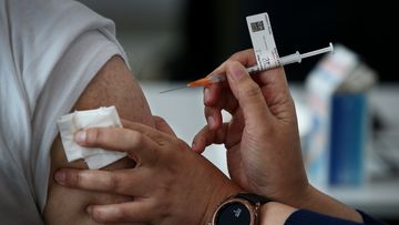 A nurse administers the Pfizer vaccine to a client at a pop-up clinic at the Lebanese Muslim Association (LMA) in Lakemba last month.