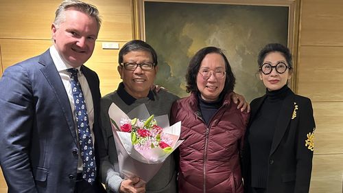 Chau Van Kham with his wife, Quynh Trang Truong, both centre, and Kham's lawyer (right) and MP Chis Bowen (left).