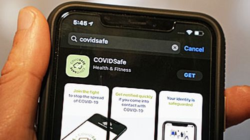 Phone with COVIDSafe download screen (AAP)