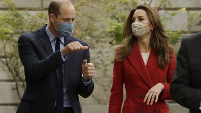 Prince William and his wife Kate the Duchess of Cambridge walk together during their visit to St. Bartholomew's Hospital in London, to mark the launch of the nationwide 'Hold Still' community photography project, Tuesday, Oct. 20, 2020