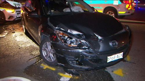 The patrol car was turning a corner in Ottoway when it collided with another Mazda sedan.