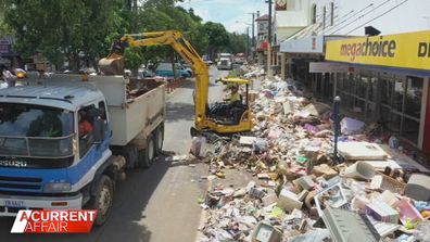 The Lismore floods caused destruction on a catastrophic scale and millions of dollars in stock was piled metres high on the street when it had to be thrown out.