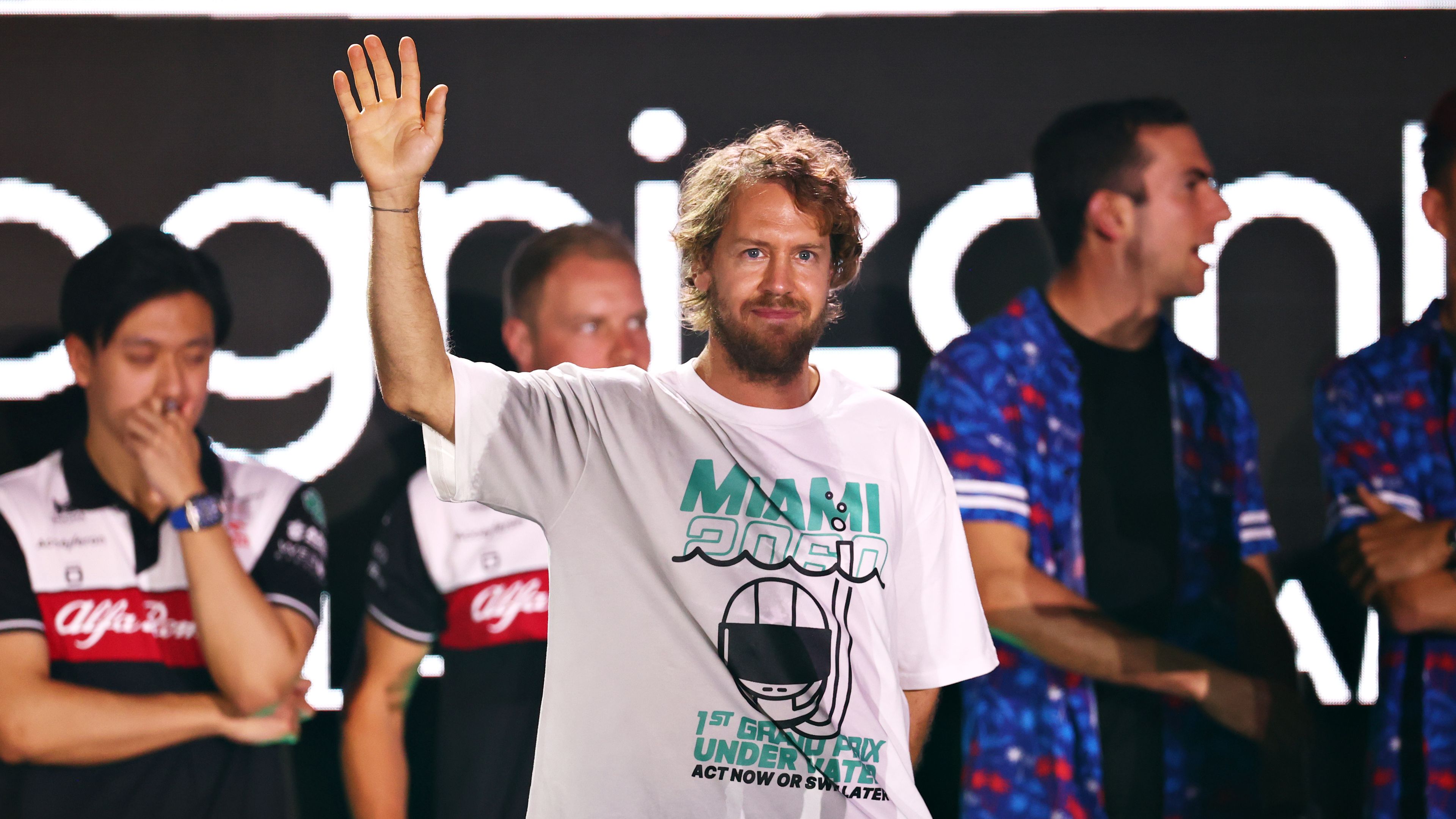 Sebastian Vettel waves to the crowd at the Miami Grand Prix launch party.
