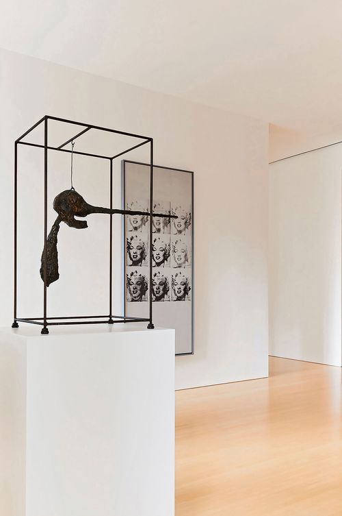 Giacometti's "Le Nez" (left) sold for $107.6 million, while Andy Warhol's "Nine Marilyns" (right) fetched $65 million.