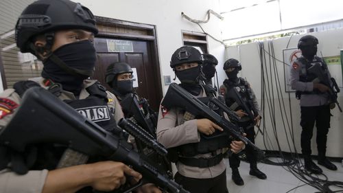 Dozens of heavily armed police officers were on-guard during a court hearing for Abdurrahman today. Picture: AAP.