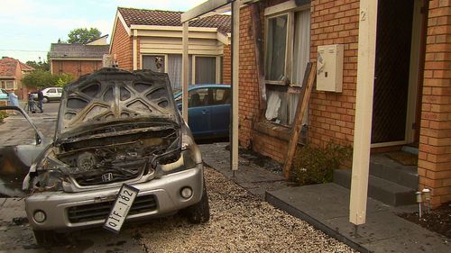 The aftermath of a car engulfed in flames.