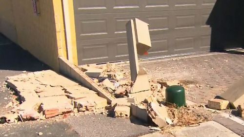 The car hit a postbox before smashing into a small brick wall.