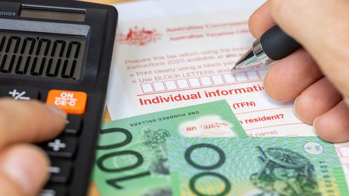 Tax return for individual. Australia tax settlement. Financial and business concept. Calculation and manual filling of the form. close up