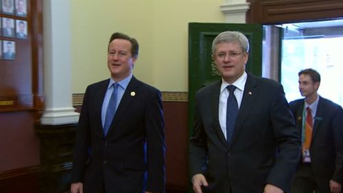 British Prime MInister David Cameron and his Canadian counterpart Stephen Harper arrive at the G20 Leaders' Retreat. (9NEWS)