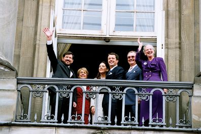 The engagement of Denmark's Crown Prince Frederik and Mary Donaldson, with her father John Donaldson and Queen Margrethe II on the Amalienborg Palace balcony October 8, 2003     