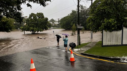 Flooding along Ithaca Creek in Bardon and Red Hill on Sunday, February 27, 2022. Credit: Matt Dennien