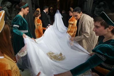 Bridesmaids arrange the train of Rebecca (Victoria) Bettarini of Italy as she arrives at St Isaac's Cathedral for her wedding to Grand Duke George Mikhailovich of Russia. 