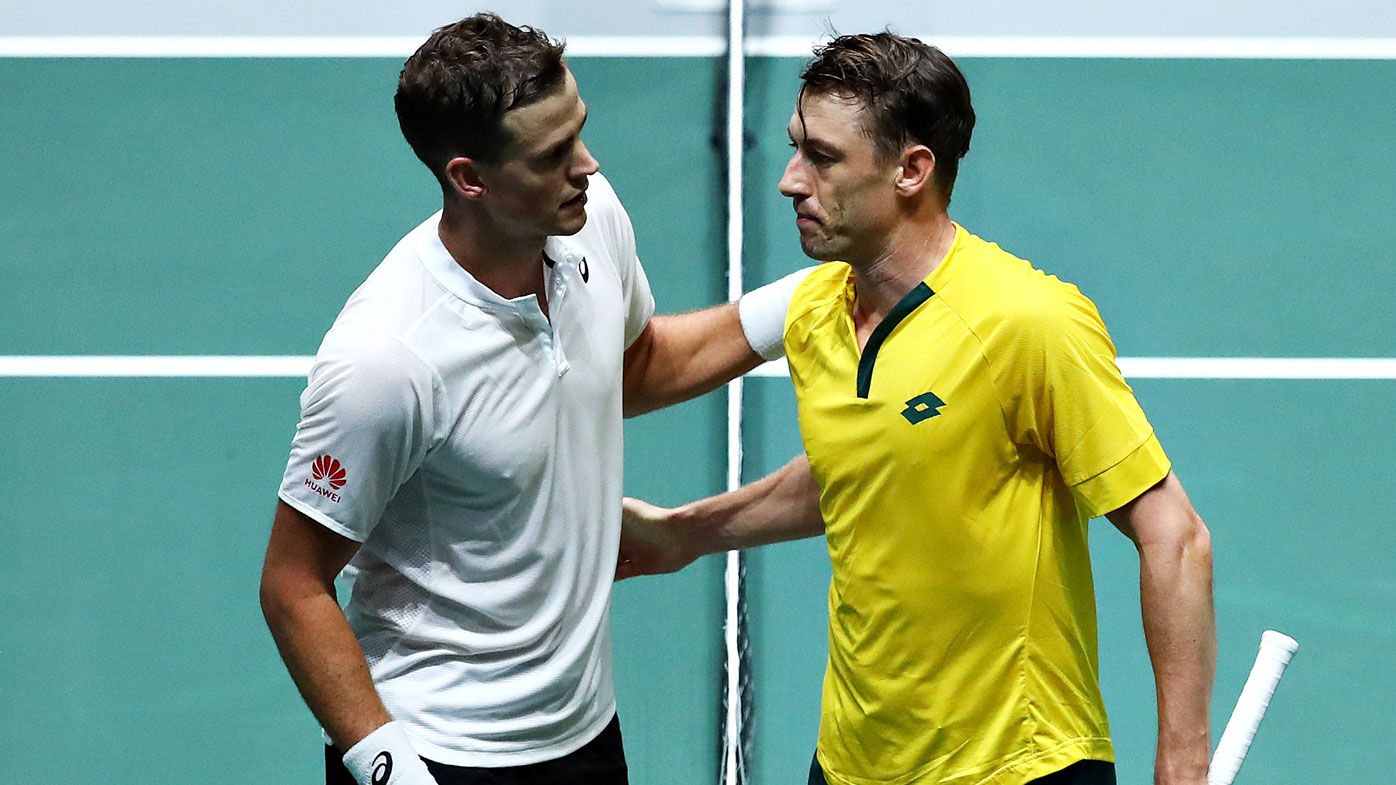 Vasek Pospisil of Canada shakes hands with John Millman of Australia after their quarter final singles match