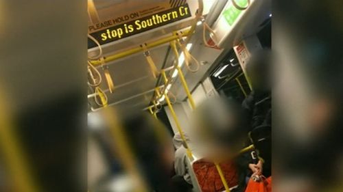 The shocking footage obtained by News Corp Australia shows two girls hurling abuse at the man until he is forced to leave the carriage.