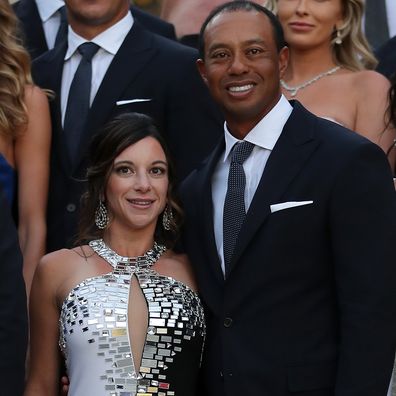 Tiger Woods of the United States poses with girlfriend Erica Herman before the Ryder Cup gala dinner.