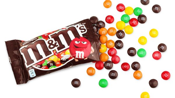 Closeup of unwrapped M&amp;M&#x27;s milk chocolate candies made by Mars Inc.