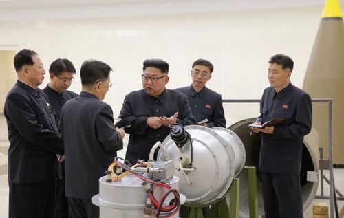 Kim Jong-un inspects the newly built mini hydrogen bombs. (Reuters/KCNA)